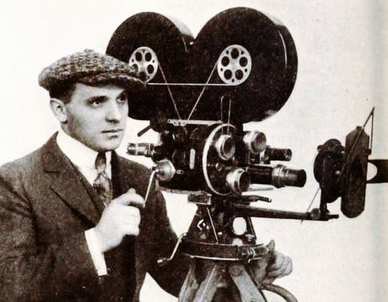 Silent Movie Director Jackson Rose photographed with a movie camera